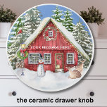 Festive Christmas Scene Snow Trees Deer Ceramic Knob<br><div class="desc">The perfect Christmas scene -- snow falling; snow covered trees; the house decorated with lights; a snowman in front; deer out front. For yourself or very special as a gift. Personalize the message as you wish. Any design issues or questions, just send a chat or an email: charmdesignstudio@rcn.com and we...</div>