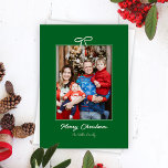 Festive Green and White Bow Christmas Photo  Holiday Card<br><div class="desc">Simple and sweet, this pine forest green Christmas holiday photo card features handwriting style fonts and a delicate, white, bow graphic to celebrate the season in on-trend and modern style. Your portrait orientation photo is framed by a thin line above a seasonal greeting and custom family name text with space...</div>