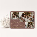 Festive Greeting | Merriest Christmas 3 Photo Foil Holiday Card<br><div class="desc">Our festive and elegant holiday card design is the perfect way to show off three of your favourite family photos. Horizontal or landscape oriented design features "Merriest Christmas" in shining gold foil typography and hand lettered script,  with your family name beneath,  on a terracotta background.</div>