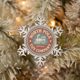 Festive North Pole toy company Snowflake Pewter Christmas Ornament