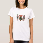 Festive Nutcrackers and Christmas Tree Design T-Shirt<br><div class="desc">The image showcases a colourful and festive Christmas-themed design featuring two traditional nutcrackers in red and green uniforms standing on either side of a beautifully decorated Christmas tree. The tree is adorned with a large red polka-dotted bow at the top, glowing yellow lights, and classic triangular branches. Snowflakes and golden...</div>