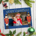 Festive Nutcrackers Christmas Frame Photo Foil Holiday Card<br><div class="desc">This festive holiday photo card features a horizontal photo on a dark blue background with two nutcrackers on each side standing guard, and the greeting "Merriest Christmas". The nutcrackers are dressed in red and dark brown and accented with gold foil. The greeting and your name are also in gold foil....</div>