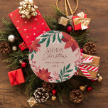 Festive Poinsettia Flowers Christmas  Classic Round Sticker<br><div class="desc">This Christmas sticker features a border of hand-drawn Poinsettia florals and leaves in red and green. This festive sticker is perfect to stick to gifts. The "Merry Christmas" text is not editable,  but the family name and year are.</div>