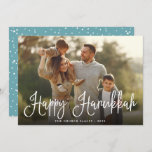 Festive Script Overlay Hanukkah Photo Holiday Card<br><div class="desc">Simple and chic Hanukkah photo card features your favourite family photo overlaid with "Happy Hanukkah" in white modern script lettering. Personalize with your family name and the year along the bottom. Cards reverse to a snow and stars pattern in festive teal and white.</div>