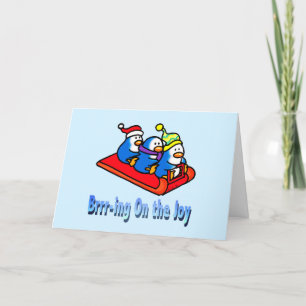 Festive Sledding Penguins in Winter Scene Holiday Card