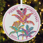 Festive Tropical Palm Trees Christmas Glass Ornament<br><div class="desc">Celebrate the season with this festive tropical palm trees Christmas ornament that brings a vibrant twist to your decor. Featuring a colourful palm trees illustration in pink, orange, blue, green, and purple hues with pink script text, this design captures the joy of a tropical holiday. Perfect for holiday decorators or...</div>