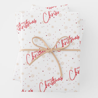 Feuille De Papier Cadeau Joyeux Noël en écriture rouge avec neige dorée