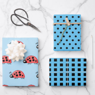 Feuille De Papier Cadeau Poupées et carrés bleus et noirs