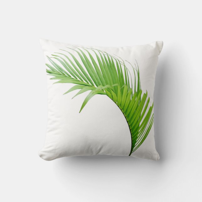 Feuille verte de palme tropicale sur coussin blanc (Recto)