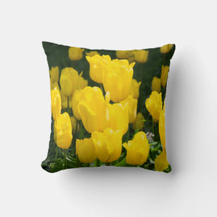 Field of bright yellow tulips throw pillow