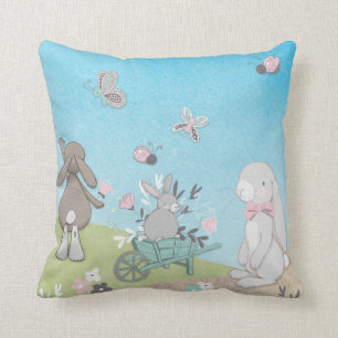 Field of spring bunnies throw pillow