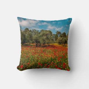 field with flowers and trees throw pillow