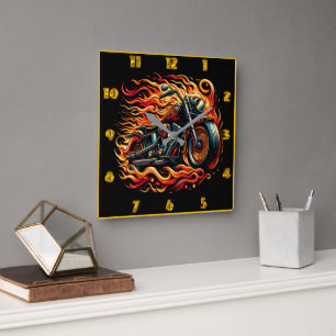 Fiery motorcycle racing through a vibrant sunset square wall clock