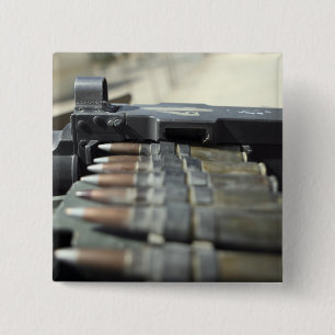 Fifty-calibre machine gun rounds 2 inch square button
