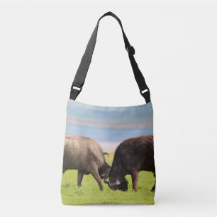 Fighting Buffalo on grassland in Africa Serengeti Crossbody Bag