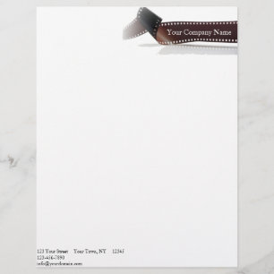 Film Strip with Reflection on White Letterhead