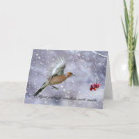 finnish christmas card with chaffinch in flight to