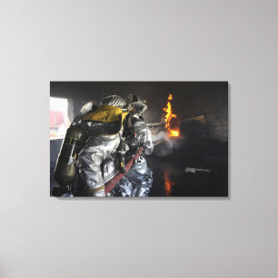 Firefighters extinguish a fire in a training ro canvas print