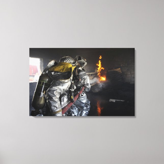 Firefighters extinguish a fire in a training ro canvas print (Front)