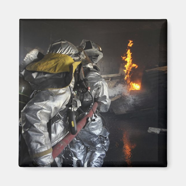 Firefighters extinguish a fire in a training ro magnet (Front)