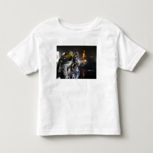 Firefighters extinguish a fire in a training ro toddler t-shirt