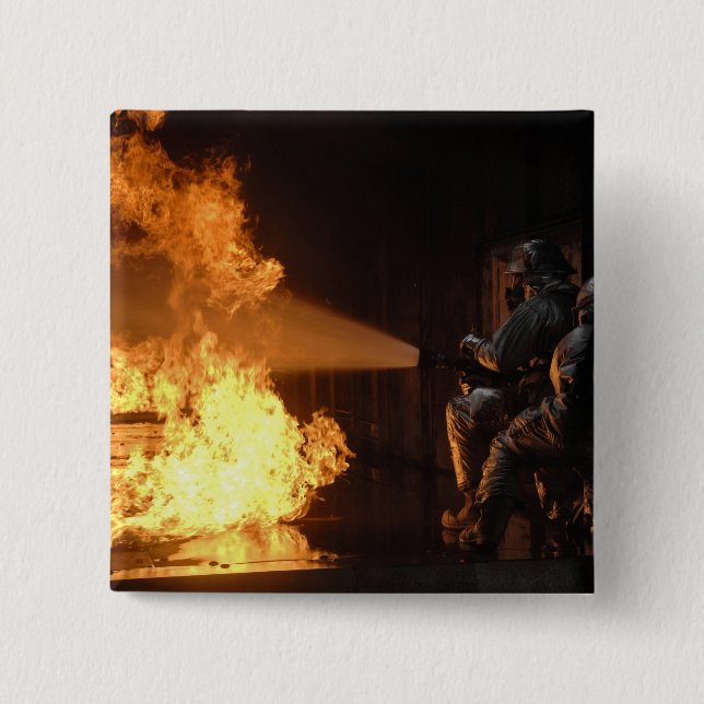Firefighters extinguish a simulated battery fir 2 inch square button (Front)