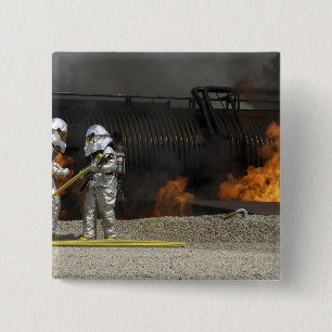 Firefighters neutralize a live fire 2 inch square button