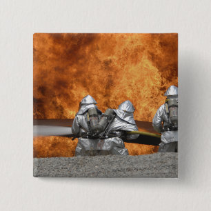 Firemen neutralize a fire 2 inch square button