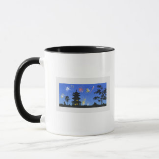 Firework display and silhouette of pagoda mug
