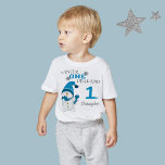 First Birthday Winter Onderland Snowman Boy  Baby T-Shirt<br><div class="desc">Winter Onederland 1st first birthday party,  holiday Christmas WinterT-shirt. Cute Little Snowman with blue beanie and scarf,  beautiful snowflakes and a light blue colour decorate the background. You can personalize this adorable invitation with your own text and photo.</div>