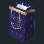 First Candle of Hanukkah Festival of Lights Party Medium Gift Bag<br><div class="desc">First Candle of Hanukkah. Happy Hanukkah Festival of lights party Gift Bag beauty Jewish holiday card. Beautiful Jewish Holiday Chanukah background with traditional Chanukah decorative symbols - wooden dreidels (spinning top), doughnuts, hanukkiah menorah, candles, star of David and glowing lights wallpaper gold hanukkiah navy blue pattern pattern. Hanukkah festival of...</div>