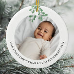 First Christmas As Grandparents Photo Mistletoe Ceramic Ornament<br><div class="desc">This Grandparent's First Christmas Ornament is decorated with watercolor mistletoe.
Easily customizable with your baby's photo,  name,  and year.
Use the Design Tool to change the text size,  style,  or colour.
Because we create our artwork you won't find this exact image from other designers.
Original Watercolor © Michele Davies.</div>