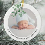 First Christmas As Parents Photo Watercolor  Ceramic Ornament<br><div class="desc">This Parent's First Christmas Ornament is decorated with watercolor mistletoe.
Easily customizable with your baby's photo,  name,  and year.
Use the Design Tool to change the text size,  style,  or colour.
Because we create our artwork you won't find this exact image from other designers.
Original Watercolor © Michele Davies.</div>