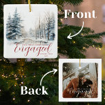 First Christmas Engaged 1 Photo Watercolor Forest Ceramic Ornament<br><div class="desc">Celebrate your love and the magic of this special season with our First Christmas Engaged 1 Photo Watercolor Forest Ceramic Ornament. This elegant and enchanting ornament captures the beauty of a watercolor winter forest and is the perfect way to commemorate your engagement during the holidays. The front of the ornament...</div>
