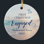 First Christmas Engaged Beach Sunset Ceramic Ornam Ceramic Ornament<br><div class="desc">Keepsake Engagement Ornament with a romantic beach sunset or sunrise over a tropical ocean with turquoise teal blue waves and pink peach sand shoreline with beautiful pastel colors is perfect for the couple who got engaged on a beach or are planning a destination wedding.</div>
