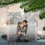 First Christmas Engaged Custom Photo White Script Glass Ornament<br><div class="desc">Commemorate your engagement with this beautiful modern keepsake ornament. The white text reads "Our first Christmas engaged, " with the word "engaged" in elegant handwriting script with flourishes before and after. Replace the sample image with your favourite photo, and add your names and the year. A dark gradient filter helps...</div>