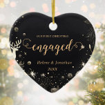 First Christmas Engaged Gold Modern Elegant Unique Ceramic Ornament<br><div class="desc">Crafted for those celebrating their first Christmas engaged, this stylish and chic First Christmas Engaged Gold Modern Elegant Unique Ceramic Ornament stands out with its black background, adding a touch of luxury to your holiday decor. Designed to be a unique addition to your Christmas tree decorations, this personalized holiday ornament...</div>