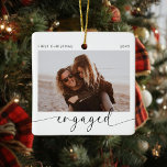 First Christmas Engaged Keepsake  Ceramic Ornament<br><div class="desc">Introducing the perfect Christmas ornament for the soon to be Mr and Mrs! This customizable ornament is the perfect way to celebrate your first Christmas together as an engaged couple. With a minimalist modern design and handwritten calligraphy, this ornament will look stunning on your tree. The best part? You get...</div>