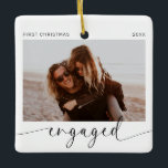First Christmas Engaged Keepsake  Ceramic Ornament<br><div class="desc">Introducing the perfect Christmas ornament for the soon to be Mr and Mrs! This customizable ornament is the perfect way to celebrate your first Christmas together as an engaged couple. With a minimalist modern design and handwritten calligraphy, this ornament will look stunning on your tree. The best part? You get...</div>