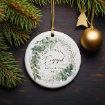 First Christmas Engaged Leaf Wreath Ceramic Ornament<br><div class="desc">🎄 Celebrate Your First Christmas Together with Elegance 🎄 Commemorate the joy of your first Christmas as a newly engaged couple with our exquisite personalized ornament. Crafted with love and attention to detail, this ceramic ornament is a perfect keepsake gift for you and your beloved or a loved one who...</div>