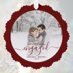 First Christmas Engaged Photo Burgundy Script Ornament Card<br><div class="desc">Commemorate your engagement with this beautiful keepsake ornament card. The burgundy text reads "Our first Christmas engaged, " with the word "engaged" in elegant handwriting script with flourishes before and after. Replace the sample image with your favourite photo, and add your names and the year. A white gradient filter helps...</div>