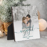 First Christmas Engaged Photo Teal Blue Script Plaque<br><div class="desc">Commemorate your engagement with this beautiful modern keepsake plaque. The teal blue text reads "Our first Christmas engaged, " with the word "engaged" in elegant faux foil handwriting script with flourishes before and after. Replace the sample image with your favourite photo, and add your names and the year. A white...</div>