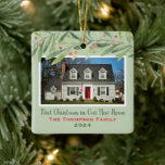 First Christmas in Our New Home Greenery Photo Ceramic Ornament<br><div class="desc">This beautiful holiday keepsake ornament features a photo of your new home with custom "First Christmas in Our New Home" script text, your family name, and the year the home was purchased. Design features modern watercolor winter greenery branches with green leaves and red berries. The light green background color can...</div>