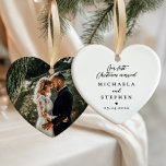 First Christmas Married Modern Minimalist Photo Ceramic Ornament<br><div class="desc">Heart-shaped “Our First Christmas Married” photo ornament is a romantic and sentimental keepsake, perfect for commemorating a couple’s first holiday season as newlyweds. The front features elegant black text in a mix of graceful script and refined serif fonts on a soft white ceramic background, accented with a delicate black heart...</div>
