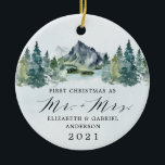 First Christmas Mr and Mrs Mountains Trees Wedding Ceramic Ornament<br><div class="desc">First Christmas features a design of an elegant watercolor mountain view scenery with a modern style text layout. Design features numerous evergreen trees in various shades of greens. The back features the matching mountains and background. Mr. Mrs. is printed in a stylish script font. A perfect keepsake for newlywed couples...</div>