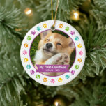 First Christmas Pet Puppy Photo Multicolor Paws Ceramic Ornament<br><div class="desc">“My First Christmas.” Celebrate your new pet’s arrival this past year! A purple plum banner with your pet’s name and year in whimsical white typography overlays your puppy or kitten’s custom photo. A playful border of multicolor purple, pink, orange, yellow, turquoise and green paw prints against white surrounds it. Feel...</div>