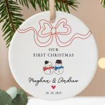 First Christmas Snowman Christmas Ceramic Ornament<br><div class="desc">Celebrate your love this holiday season with our personalized Christmas ornament featuring an adorable snowman couple adorned with a trendy ribbon bow. This charming keepsake is perfect for commemorating your first Christmas together, adding a touch of warmth and joy to your festive decor. Crafted with care, it can be customized...</div>