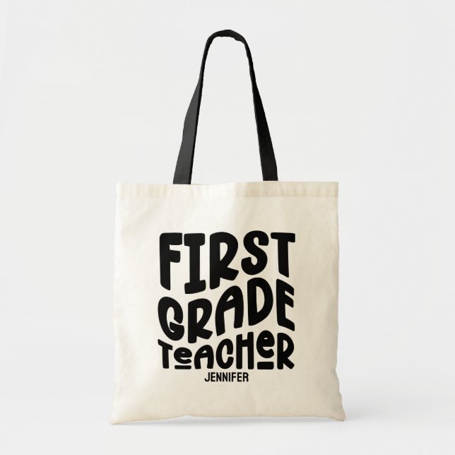 First Grade Teacher Black Typography Design Tote Bag (Front)