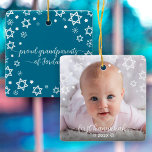 First Hanukkah Baby Snowflakes Stars Grandparents Ceramic Ornament<br><div class="desc">“First Hanukkah.” A playful visual of white Stars of David, snowflakes and handwritten script typography with customized year, overlaying the photo of your choice, help you usher in Hanukkah and New Year. On the back, additional white Stars of David, snowflakes and handwritten typography with “proud grandparents of baby’s name” overlay...</div>