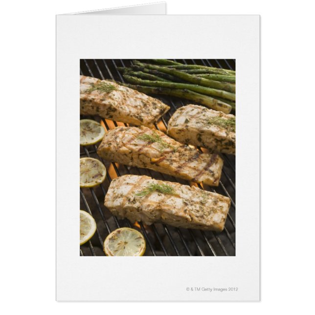 Fish and asparagus cooking on grill (Front)